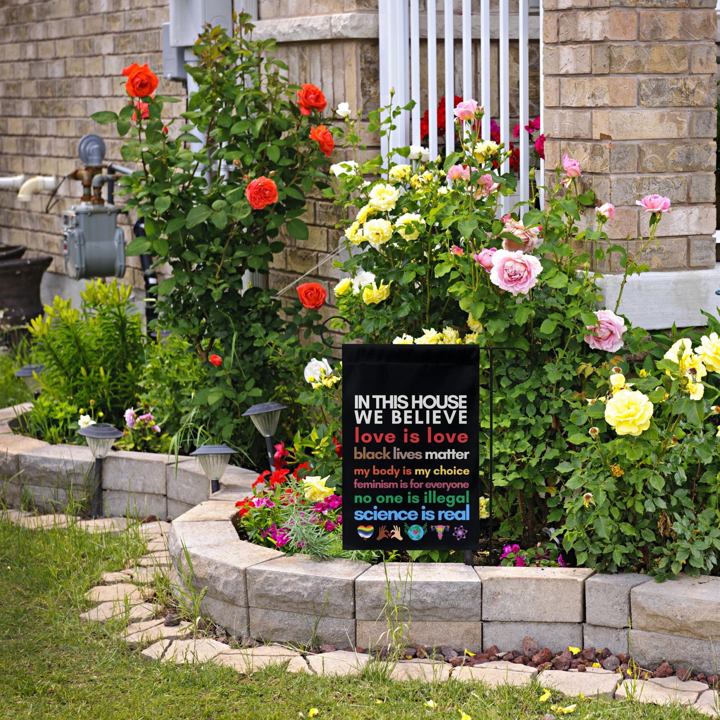 in this house we believe love, Black Lives Matter, my body my choice, feminism is for everyone, no one is illegal science is real flag