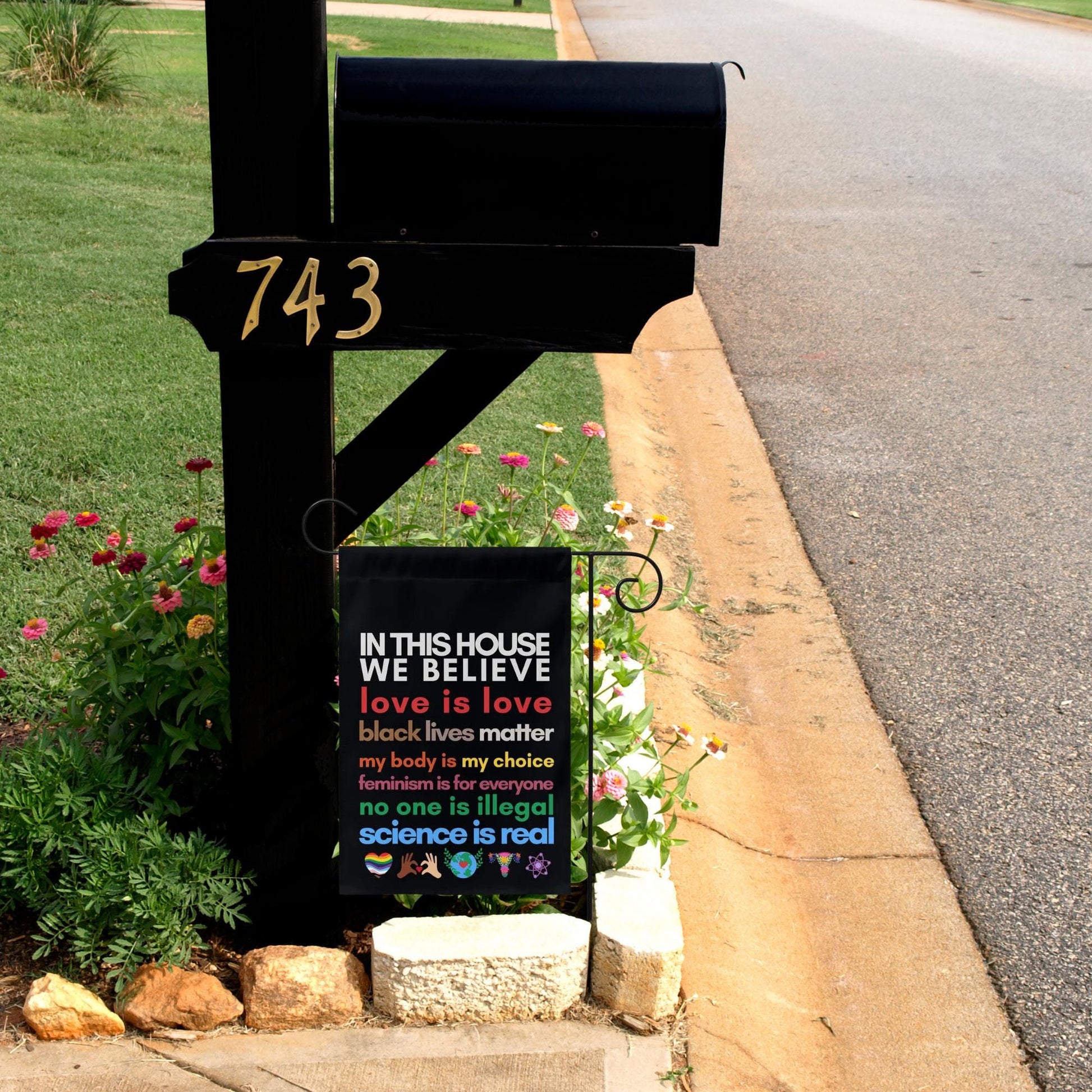 in this house we believe love, Black Lives Matter, my body my choice, feminism is for everyone, no one is illegal science is real flag